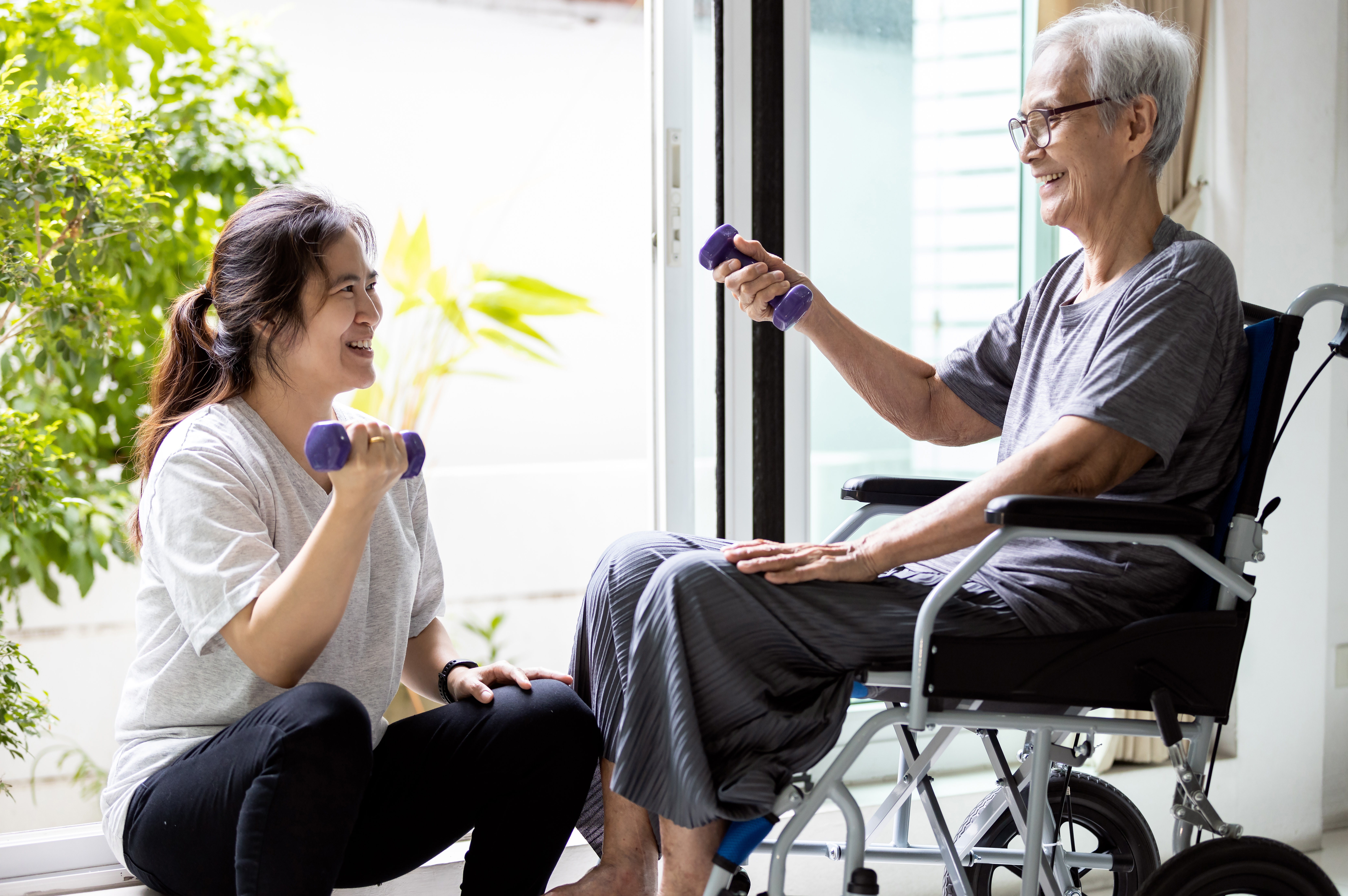patient and physical therapist exercising